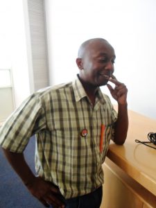 Nyathi showing off his badge and pen